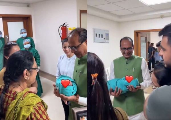 अस्पताल में शिवराज सिंह के हाथ में पोता सौंपते हुए नर्स (वीडियो से ली गई तस्वीर)