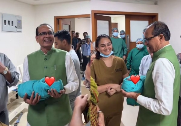 अस्पताल में शिवराज सिंह के हाथ में पोता सौंपते हुए नर्स (वीडियो से ली गई तस्वीर)